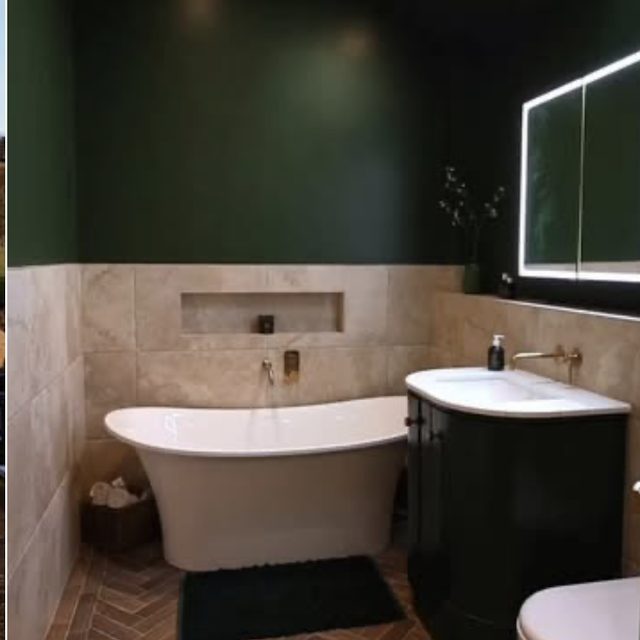 Deep green bathroom with freestanding bath, brushed brass and herringbone floor.
